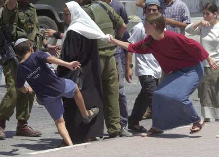 zionist_attack_woman_being_kicked.jpg 