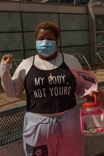 young black woman with t-shirt "my body not yours"
