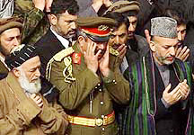 Hamid Karzai, right, Deputy Defence Minister Gen. Abdul Rashid Dostum, centre, and former Afghan Pre